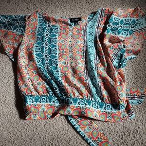 Super cute pattern top with bow in the back